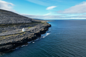 Black Head Lighthouse in the rocky landscape of the Burren, Ireland