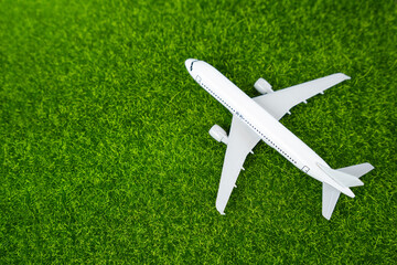 Passenger plane on the grass. Green air transportation of passengers and cargo. Environmentally friendly aircraft, green fuel. Technological innovations in aviation industry.
