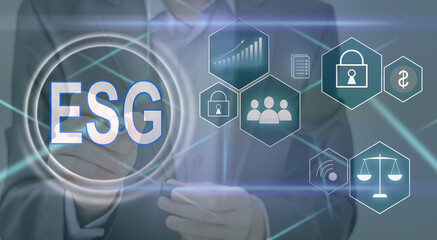 ESG environmental social governance investment business concept. analyze ESG data. icons pop up on virtual screen in business sustainability investment strategy concept