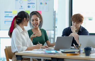 Team of Asian business people and working together in office, Startup projects and business presentation.