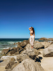 Beautiful young woman on the background of the sea. Corsica. France