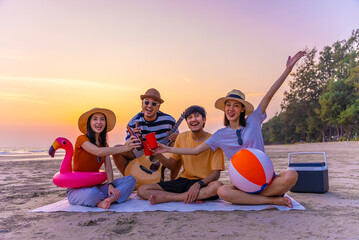 People vacation lifestyle journey concept. Happy asian diverse group friends having a picnic hang...