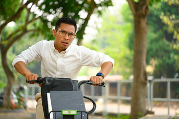 Young businessman commuting riding bicycle go to work during the morning rush