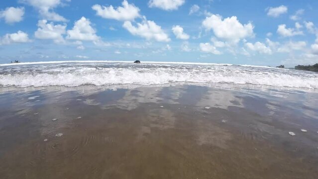 Waves slowly break towards the camera, captured in slow motion 4K Resolution