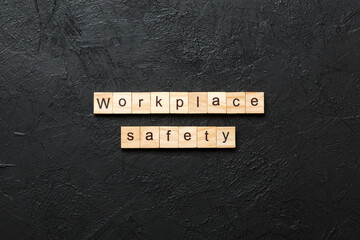 workplace safety word written on wood block. workplace safety text on table, concept