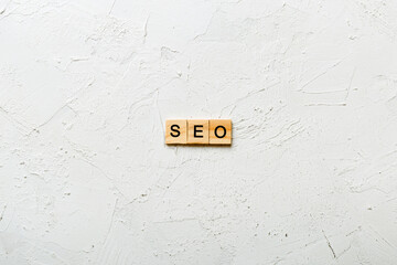 seo word written on wood block. Search Engine Optimization text on table, concept