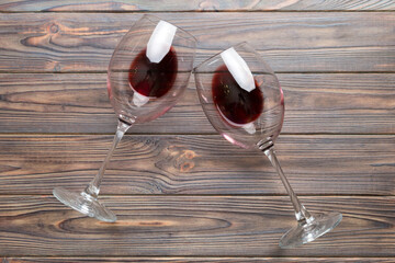 Many glasses of red wine at wine tasting. Concept of red wine on colored background. Top view, flat...