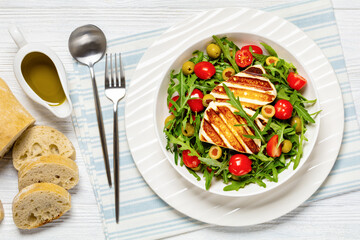 salad with grilled halloumi greek cheese in bowl