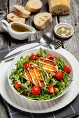 salad with grilled halloumi greek cheese in bowl