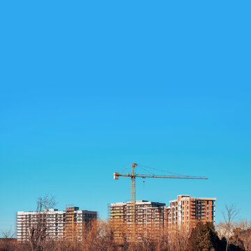 Residential building skyscrapers construction site with tall cranes