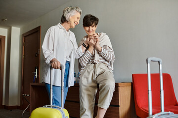 Fototapeta premium A loving tender senior lesbian couple standing together.