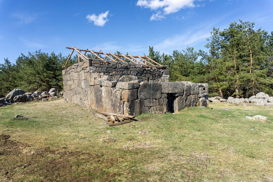 Aia Constantine church of Tejisi village. Megalithic wall and portal. Forest around
