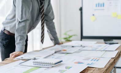 Analyzing results, an accountant, businessman or financial expert analyzes results. Calculates...