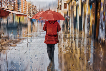 People with an umbrella in rainy days in Bilbao, basque country, spain