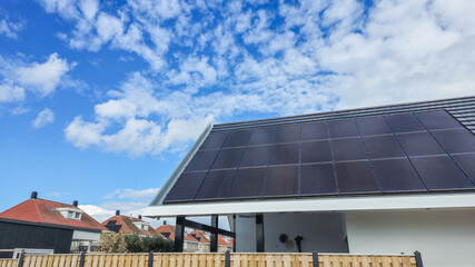 A modern house with a sleek solar panel on its roof, harnessing renewable energy to power the home...