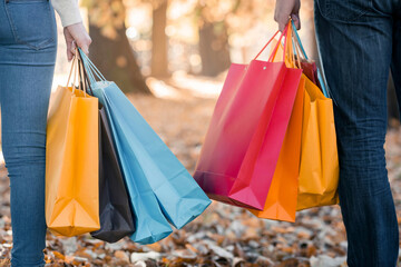  Retail Adventure: Woman Holding Shopper with Shopping Bags on Escalator - Captured in Crisp 4K image