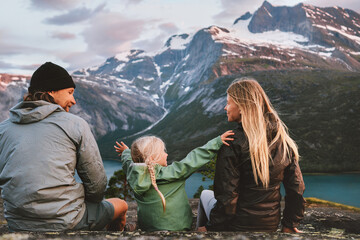 Family vacations outdoor travel lifestyle adventure trip in Norway mother, father and child hiking together healthy lifestyle parents man and woman with kid daughter eco tourism in mountains