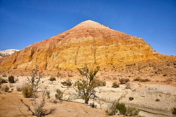 view of red sandstone mountain with traces of water erosion Altyn Emel National Park, Kazakhstan