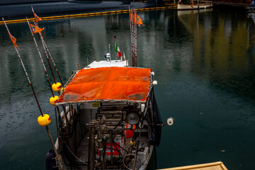 Fototapeta na wymiar Fishing boats in Genova harbor. Genoa, Liguria, Italy.