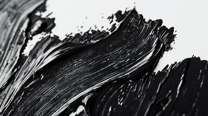 A study in contrasts: stark black brush strokes contrast against the purity of a white background.