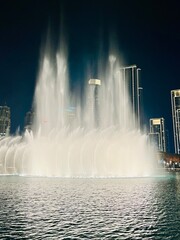 City fountains show, night time, illumination, water performance
