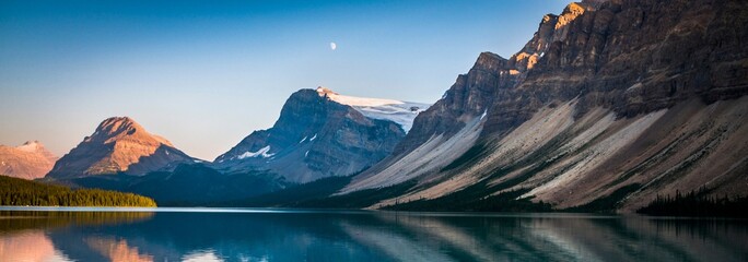 Golden Tranquility: Sunset at Bow Lake in the Canadian Rockies, Banff National Park, Alberta,...