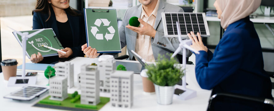 business team people planning and discussing on recycle reduce reuse policy symbol in office meeting room. Green business company and Solar Energy.