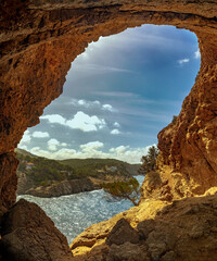 View of Cap Gross cape from a cave in the cliff, Sant Antoni de Portmany, Ibiza, Balearic Islands, Spain
