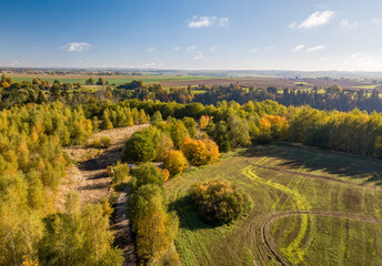 Aerial view of autumn sunrise countryside, traditional fall landscape with rising sun in Central Europe. Landscape from bird eye. Czech Republic,Vysocina highland