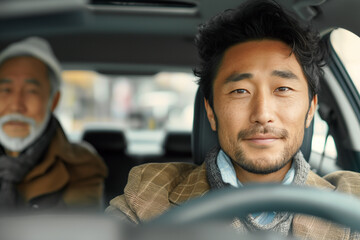 Obraz premium Two Asian men inside a car.