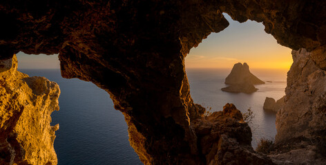 Panoramic view of Es Vedrá island at sunset from Eye of Es Vedra cave, Sant Josep de Sa Talaia,...