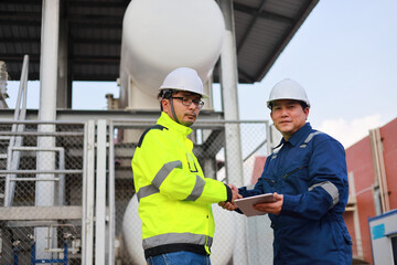 Portrait of professional man engineer working checking work place to keep liquid helium in industry.