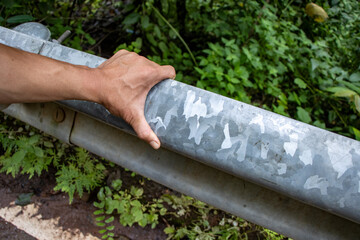 Selective focus Guard Rail steel guardrail in front of the roadside Beautiful metallic camouflage...