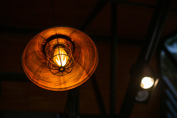 Orange vintage lamp In a modern cafe, There is space for text.