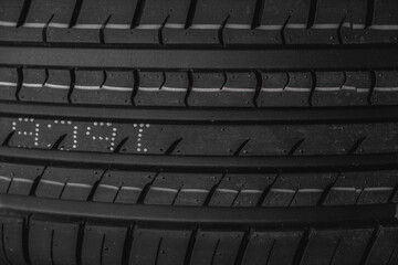 Car tire texture background. Black and white car tyre close up.