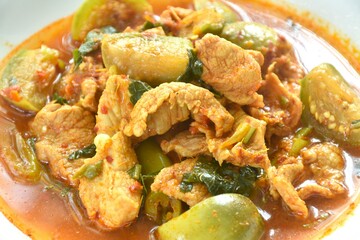 spicy boiled slice pork with eggplant in curry soup on plate