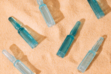 Close-up of blue ampoules with intense moisturizing concentrate with hyaluronic acid