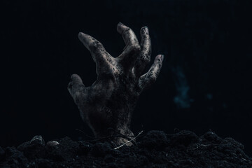 Zombie hand on dark background. Halloween concept. Horror theme.