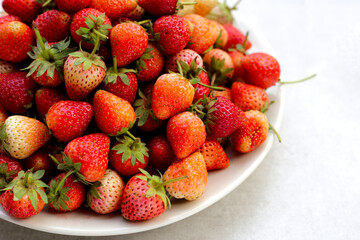 Fresh strawberry on round plate