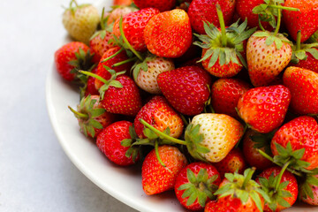 Fresh strawberry on round plate