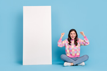 Full length photo of young cheerful girl rejoice luck triumph hooray discount isolated over blue...