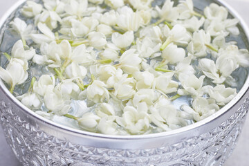 Water with jasmine flower. Thai tradition, Songkran festival concept