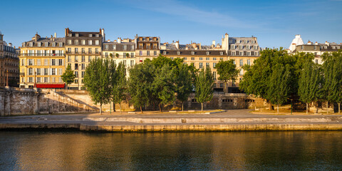 Paris buildings on a Summer morning along the River Seine (UNESCO World Heritage site). Sunlight...
