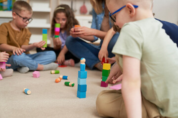 Children using toy block for sensory exercises