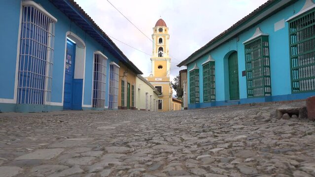 Low angle steadicam shot of quiet streets of historic colonial Trinidad town in Cuba
