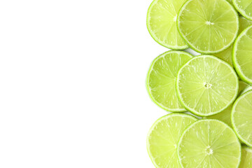 Fresh juicy lime slices on white background, flat lay. Space for text