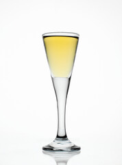 Glass full of aquavit spirit isolated on white background