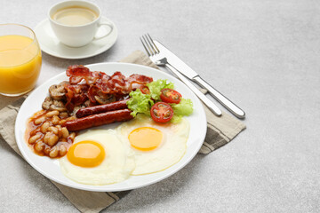 Delicious breakfast with sunny side up eggs on light table. Space for text