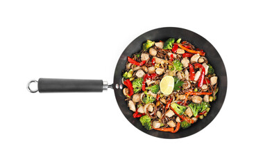 Stir-fry. Tasty noodles with meat and vegetables in wok isolated on white, top view