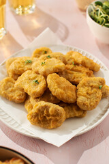Plate of chicken nuggets on table, fast food dish